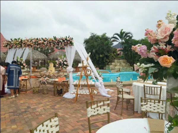 Event hall at Oceanic Hostería set up for a wedding with floral decoration in Puerto López, Ecuador