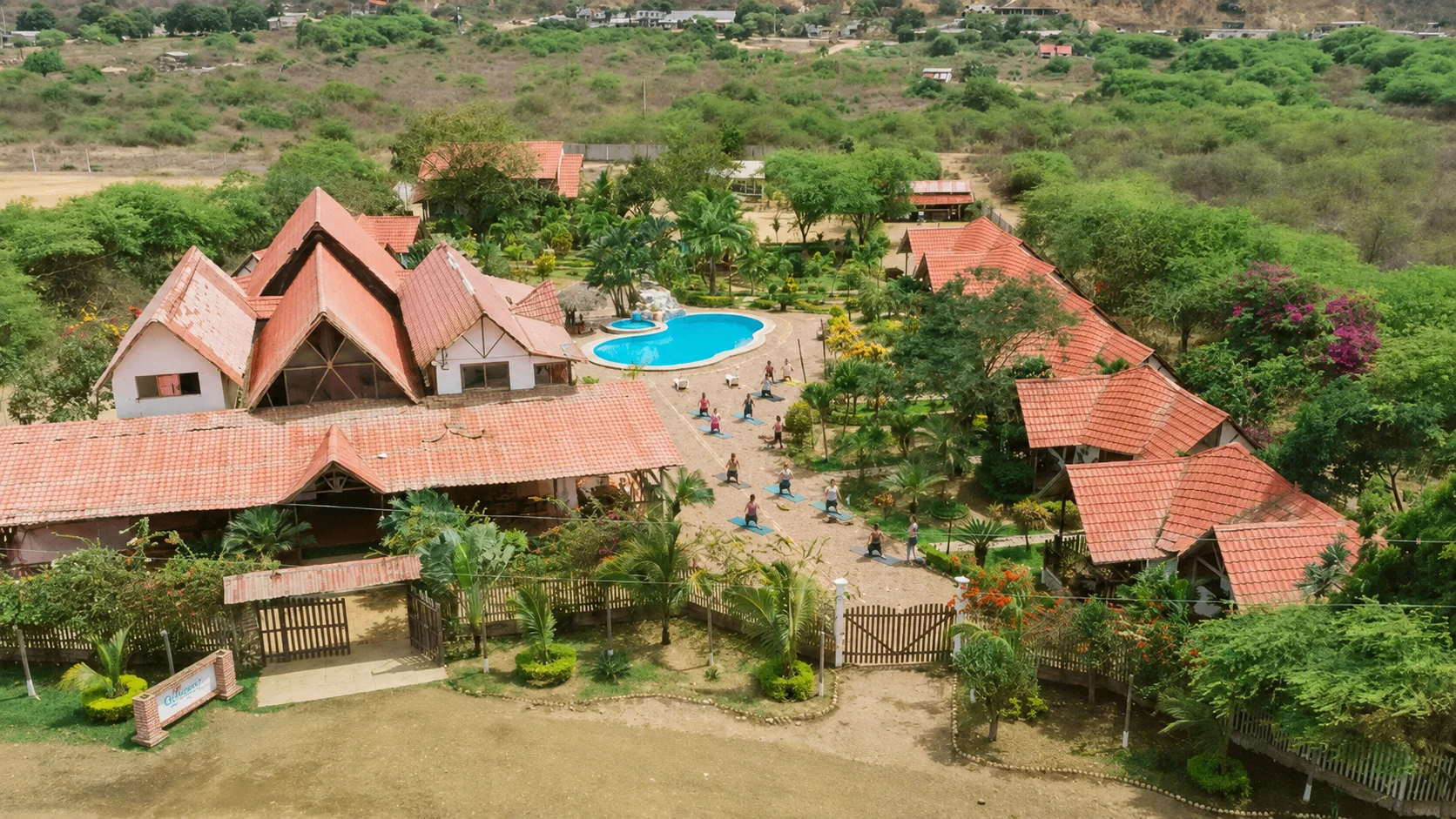 Pool at Oceanic Hostería surrounded by tropical gardens, Puerto López